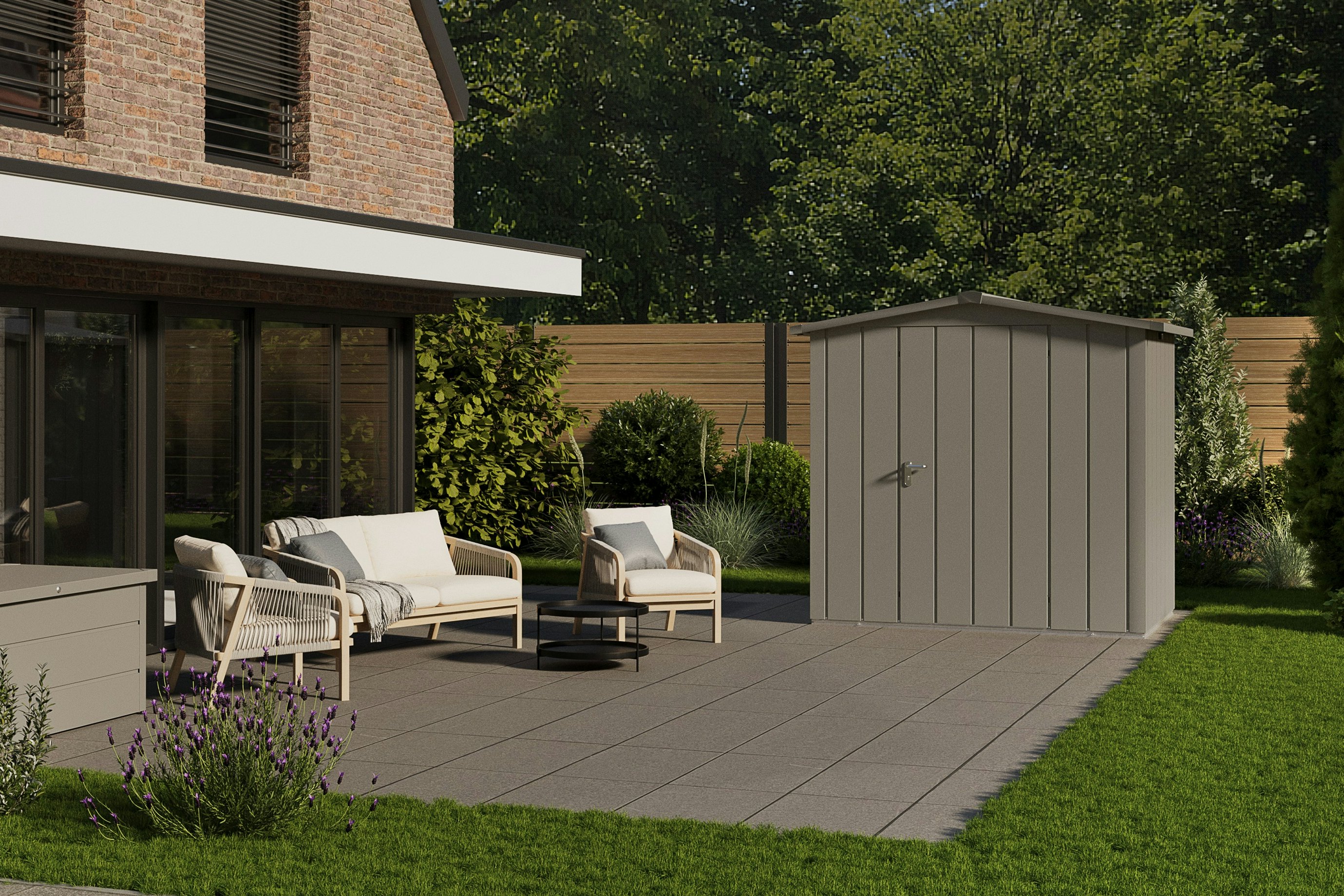 The Juno tool sheds made of galvanized sheet steel with coil coating are weather and mould-resistant, UV-resistant and non-flammable. Brick house with a patio and grey tool shed