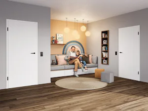 Your home is where you create the most cherished memories... Father sits with his son in the children's room and reads a book