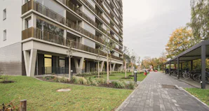 Photo title As a result, the new façade facing the arcades was moved outwards by a considerable distance, and the previously irregular layout of the flats was straightened out, creating a more harmonious visual...