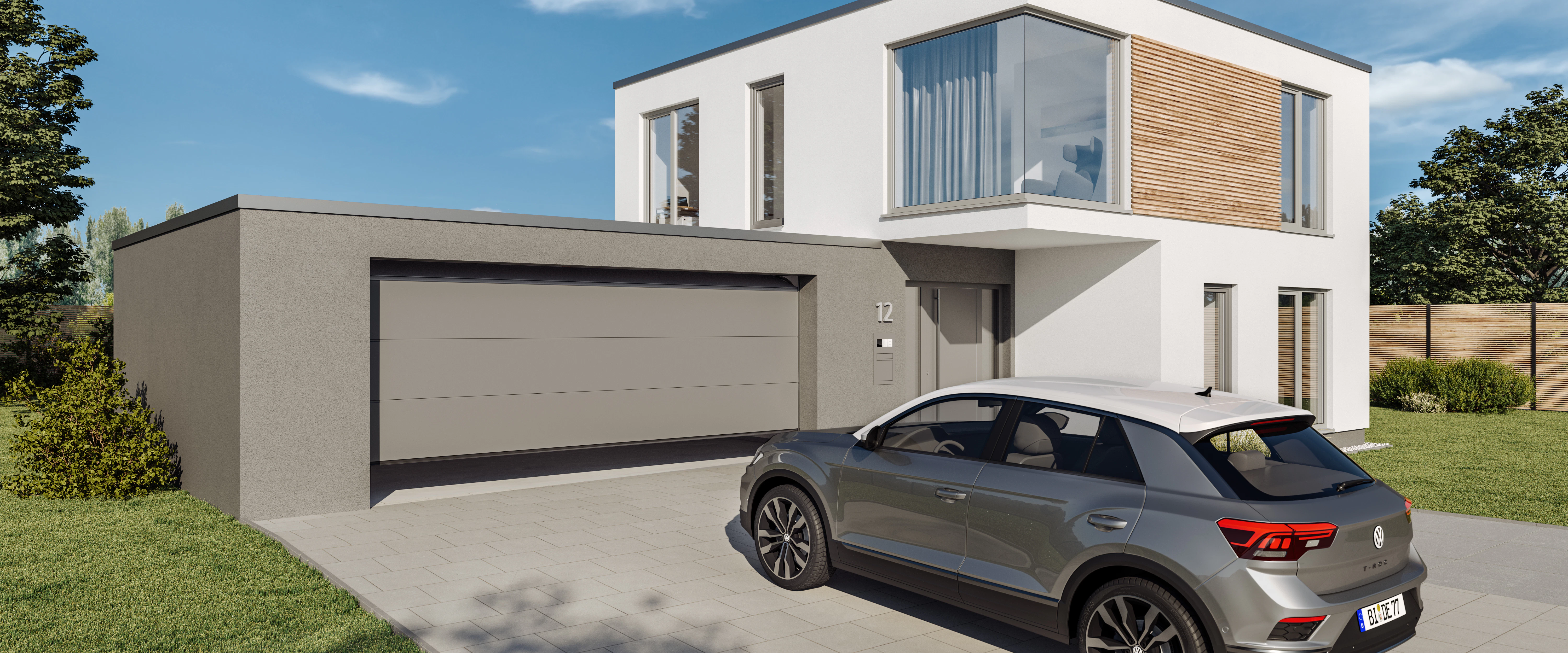 Auto staat op oprit voor modern huis met een Sectionale garagedeur van Hörmann