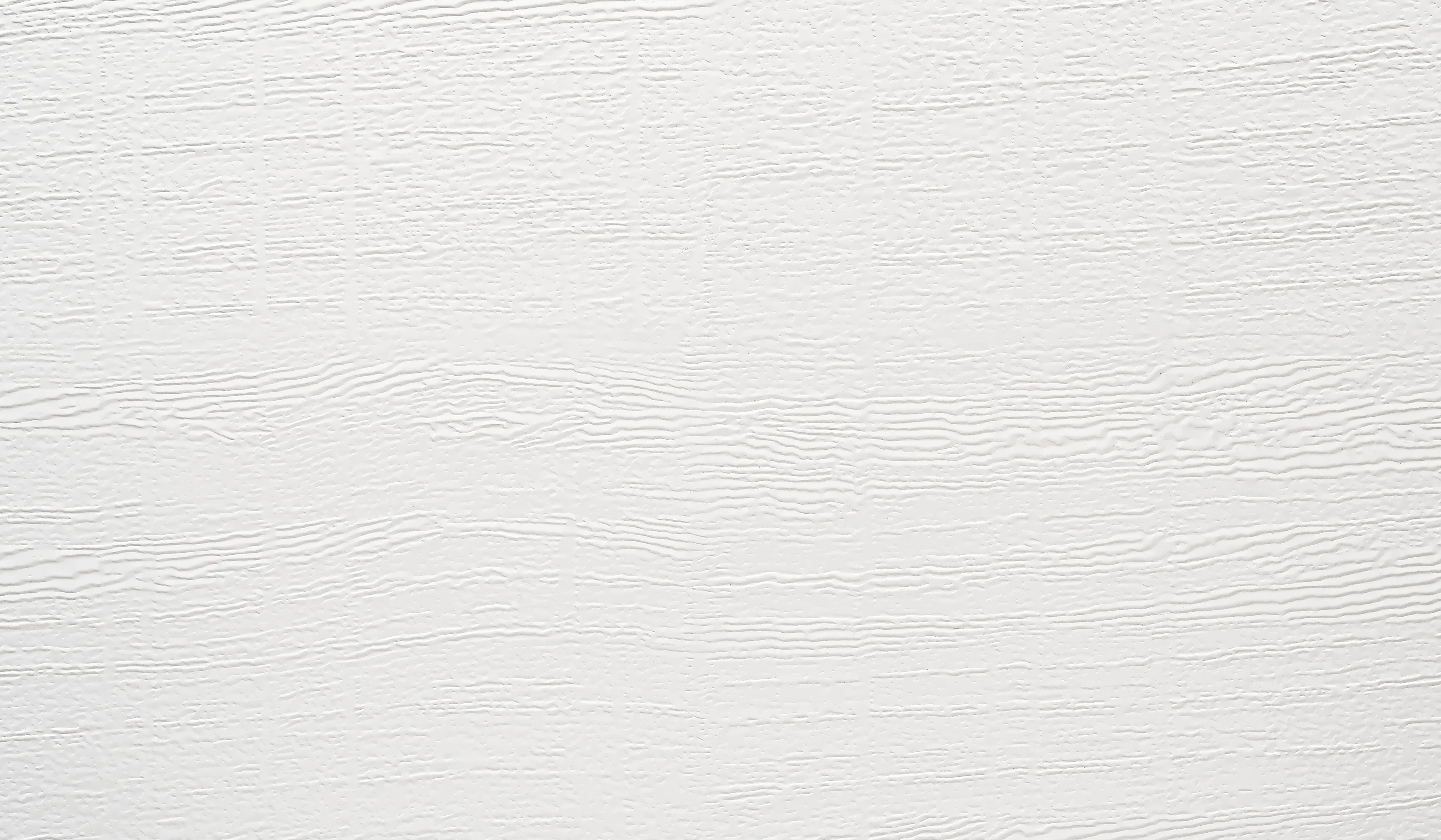 La surface robuste avec motif à trait de scie permet de corriger sans problème les petites rayures. Cette surface est disponible en blanc trafic RAL 9016, en 15 couleurs préférentielles ou en RAL au choix et de nombreuses couleurs du nuancier NCS. En version VarioDesign, il est également possible de choisir des lames individuelles dans les décors Duragrain ou Decograin.**