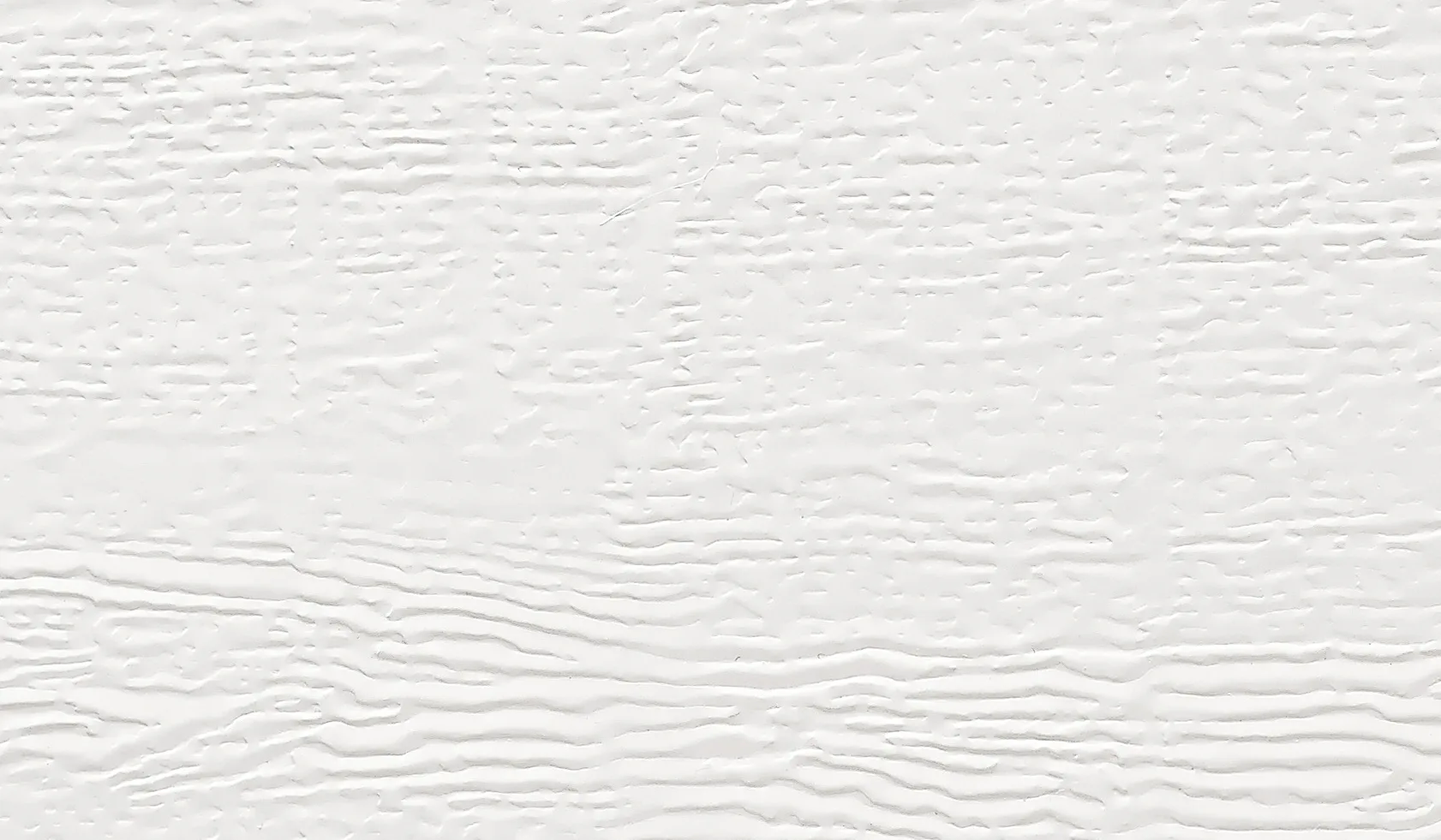 La surface Woodgrain, économique et robuste à structure imitant des traits de scie, permet de corriger sans problème les petites rayures.
