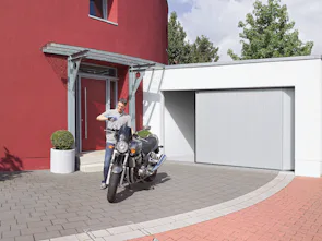 Porta garage sezionale scorrevole laterale