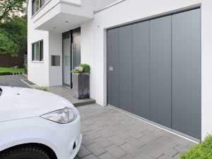 L-ribbed Hörmann side sliding sectional doors are the ideal solution for special fitting situations.
In contrast to up-and-over doors, sectional doors or roller garage doors, this type of door opens to the...