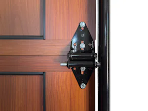 Black powder coated hardware and track Black powder coated hardware and track on a dark cherry wood Hörmann Infinity Classic Aluminum garage door