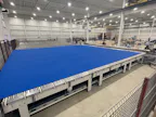 3. Advanced Rubber Curtain Assembly
The Technology:A... 3. Advanced Rubber Curtain Assembly
The Technology:A custom-built curtain assembly system allows workers to fabricate curtains at ergonomic standing height rather than kneeling on the floor....