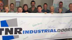 TNR Industrial Doors: The Return to Barrie (2003)
Many... TNR Industrial Doors: The Return to Barrie (2003)
Many former M&I employees remained in Barrie, and in 2003, they founded TNR Industrial Doors with just six people and deep expertise. Shortly after...