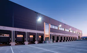 HR Vehicle Restraint
The Model HR secures the trailer's... Long Building with Row of Loading Dock Openings